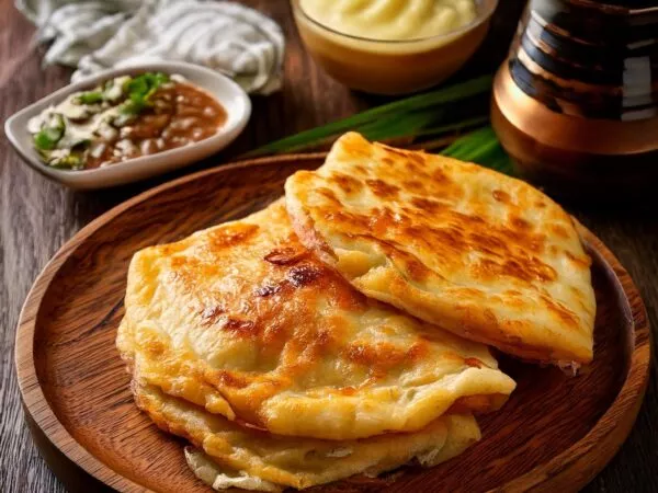 Roti Canai eten in Maleisië